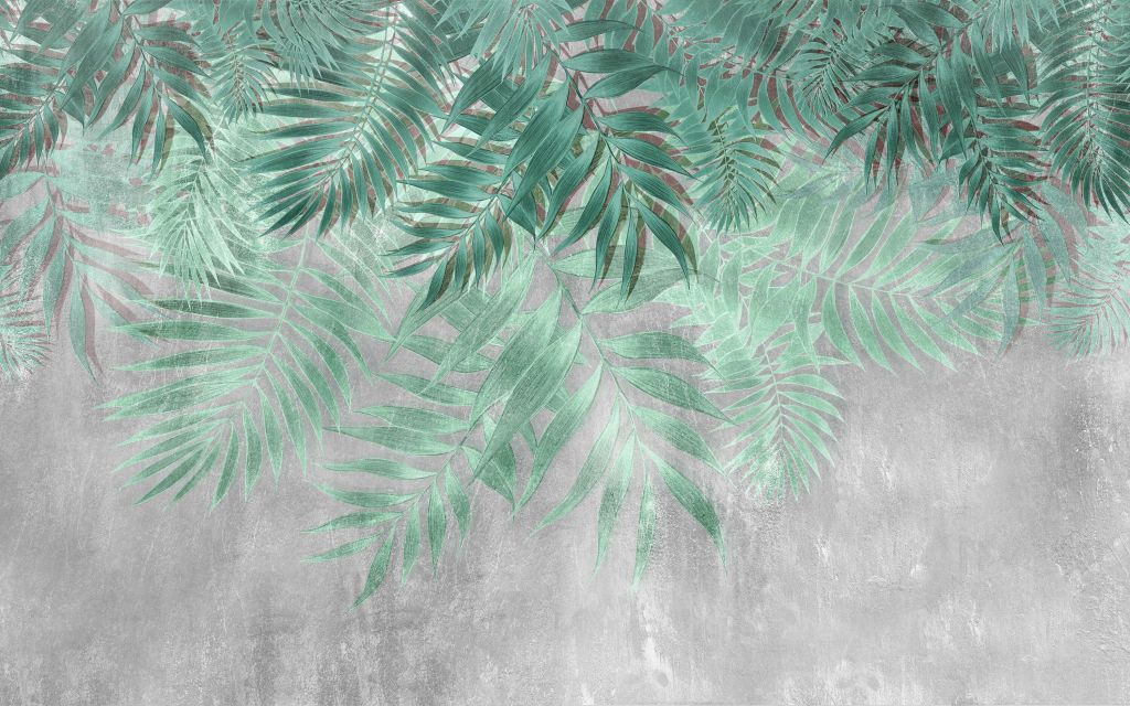 Grüne Palmenblätter mit grauer Betonwand