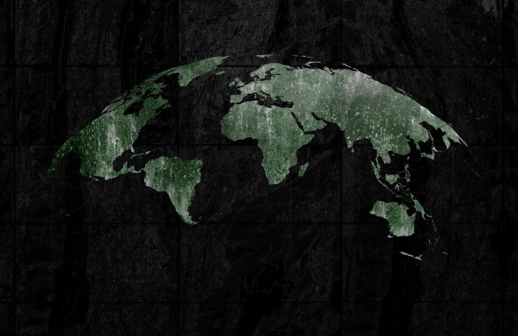 Grüne Weltkarte auf Beton